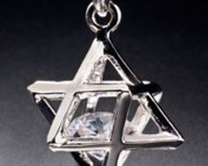 Part of sacred geometry, the Merkaba originates from Egypt and represents Man reaching up to God and God reaching down to Man. It is the vehicle to help get mind, body, and spirit in sync. It is in most major religions and metaphysical thought Silver Cubic Zirconia Star Of David Jewelry, Silver Symbolic Jewelry For Celebrations, White Gold Star Of David Jewelry Gift, White Gold Star Of David Jewelry For Gift, Spiritual Star Of David White Gold Jewelry, Spiritual White Gold Star Of David Jewelry, White Gold Star Of David Spiritual Jewelry, Sacred Geometry Jewelry, Geometry Jewelry