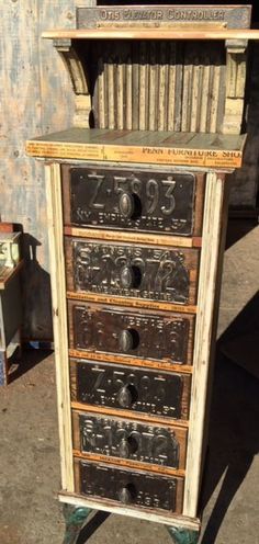 an old wooden cabinet with numbers on it