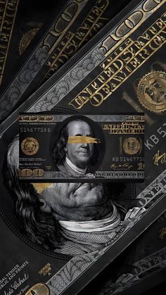 an image of a person's face on the back of money bills with gold foil