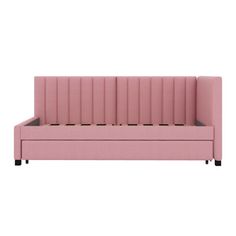 a pink couch sitting on top of a white floor