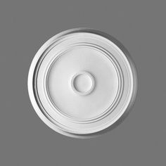 an overhead view of a white ceiling light fixture with a circular hole in the center