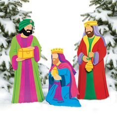 the three wise men are standing in the snow