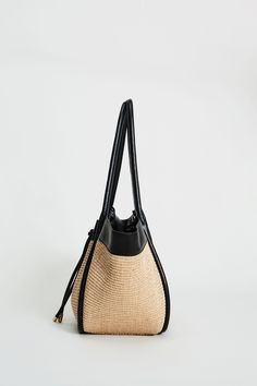 Step into Spring in style with our exclusive Raffia Tote Bag. Handcrafted in Italy, our chic, drawstring handbag is designed in the finest raffia fabric with contrasting Nappa Leather trim & gold handwear. With so many essentials to carry these days, this handbag puts the fashion in function with its knot Closure & ruched detailing. Elie Tahari Exclusive Raffia & Italian Leather Tote Bag with Gold Stud accents & a drawstring Knot Closure Measurements: 10" L, 20" Width, 12" Opening; Base 8"x6" Ma Luxury Crochet Tote Bag For Travel, Luxury Crochet Bag With Braided Handles For Shopping, Luxury Crochet Travel Bag With Double Handles, Luxury Woven Leather Straw Bucket Bag, Luxury Straw Bucket Bag With Woven Leather, Luxury Rectangular Straw Bucket Bag, Luxury Straw Tote Shoulder Bag, Luxury Straw Bucket Bag With Bamboo Handle, Luxury Crochet Tote Bag With Leather Handles