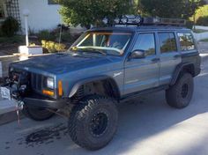 the jeep is parked on the side of the road