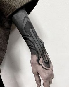 a man with a tattoo on his arm