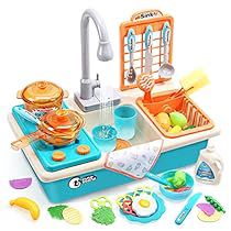 a toy kitchen with lots of food and utensils