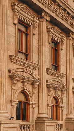 an old building with many windows and balconies