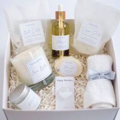 a gift box containing candles, soaps, and personal care items for someone's special occasion