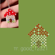 a hand holding a tiny red mushroom house beaded charm on a chain necklace with the words it good 1221