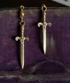 Gold Sword Earrings, Gold Dagger Earrings, Dagger Jewelry Sword Earrings, Sword Dagger Earrings, Jewelry Dagger Charms Sword Pendant Gold Alt Jewelry, Edgy Gold Jewelry, Masculine Earrings, Dagger Jewelry, Dark Academia Earrings, Hope Mikaelson Aesthetic, Academia Earrings, Medieval Earrings