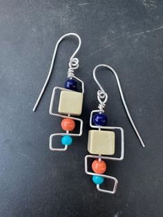 Introducing our Retro Collection from Nonnie Up! These earrings are a delightful throwback, featuring an eclectic mix of geometric designs, colorful beads, and playful elements that capture a vintage vibe. Each piece is crafted with care, incorporating materials like glass beads, ceramic accents, and wire frames that dance between funky and sophisticated. Whether you're looking to add a splash of color or a dash of nostalgia to your outfit, this collection brings a creative twist to classic designs. Perfect for anyone who loves a unique, artisan touch in their accessories, these earrings are sure to become a treasured part of your jewelry box.  **Spot an earring that caught your eye but dreaming of a different bead color? 🌈✨ Pop us a message! We love making these earrings just right for y Cheap Retro Dangle Jewelry, Cheap Colorful Retro Jewelry, Affordable Handmade Retro Jewelry, Modern Multicolor Dangle Jewelry, Retro Multicolor Drop Earrings, Multicolor Nickel-free Retro Jewelry, Modern Jewelry With Colorful Beads, Retro Multicolor Nickel-free Jewelry, Retro Multicolor Jewelry With Matching Earrings