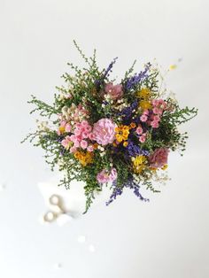 a bouquet of flowers sitting on top of a table