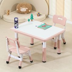 a child's table and chair set up in a room