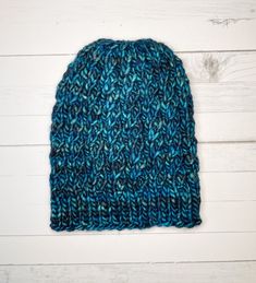 I have fallen in love with this yarn and pattern! This hat is a twisted rib cable made from 100% superwash merino wool by Malabrigo Yarns.  Details: - The yarn is 100% merino wool called Noventa by Malabringo and is made in Peru. - The hat is sized for an adult and measures FLAT at about 8.5 inches from bottom of band to top and 7 inches across the band. Both pattern and yarn have a lot of stretch to them. - Machine washable! Machine wash in cold water on a gentle cycle. DO NOT tumble dry but instead lay it out flat to dry. You will receive the hat as shown in the photos however please note that while I do my best to ensure that all colors are represented to their fullest beauty, lighting and computer screens may cause the colors to appear slightly different than the final product.  Patter Casual Crochet Cable Knit Hat, Casual Cable Knit Crochet Hat, Cable Knit Crochet Beanie Hat, One-size Cable Knit Beanie, One Size Cable Knit Beanie, One-size Cable Knit Crochet Hat, Cable Knit Beanie One Size Fits Most, One Size Cable Knit Crochet Hat, One-size Cable Knit Yarn Beanie