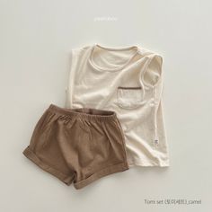 Description: This is a two-piece cozy, comfy sleeveless top with pocket and matching short set. The shorts have an elastic waistband. This set is perfect for the summer months! Size: 2T 3T 4T 5 6 7 8 9 Care Instructions: Machine wash cold, gentle cycle, hang dry for best results or tumble dry low. 100% Cotton REMINDER: For Child's safety, garment should fit snugly. Beige Playwear Sets For Summer, Summer Beige Playwear Sets, Solid Sleeveless Top With Pockets, Beige Cotton Short Sets, Casual Solid Color Cotton Short Set, Casual Cotton Short Set For Playwear, Beige Tops For Summer Playwear, Casual Beige Playwear Sets, Cute Sleeveless Loungewear Sets