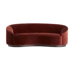 an oval shaped couch in red velvet