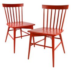 two wooden chairs sitting next to each other