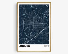 a framed map of auburn, with the words auburn in white and blue on it