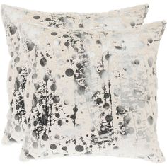 two black and white pillows on a white background