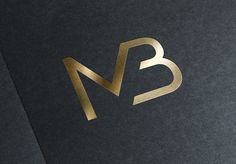 the letter b is made up of gold foil and has a black background with golden lettering