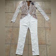 White And Lace Jumpsuit With A Very Thick Stretchy Material. Nwts And Never Worn. In Perfect Condition Fitted White Pantsuit For Night Out, White Fitted Pantsuit For Night Out, Fitted White Pantsuit For Party, White Fitted Pantsuit For Party, White Fitted Jumpsuit For Night Out, White Long Sleeve Pantsuit For Party, White Spring Party Pantsuit, Michael Costello, Lace Jumpsuit