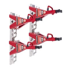 two red jacks are attached to the side of each other on a white background