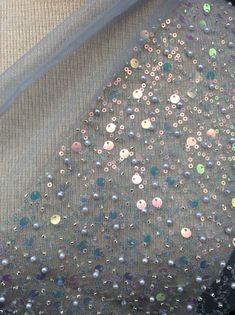 Sequins grey fancy fabric, use it for an evening gown or use it as a tablecloth Although care is take to reproduce exact color, variances will occur from screen to screen. This listing is for 22 inches x 6 inches Party Tulle Fabric With Sequins, Party Shimmer Tulle Fabric, Elegant Sequined Tulle Fabric For Parties, Silver Sequined Tulle Fabric For Party, Elegant Silver Tulle Fabric For Party, Fancy Fabric, Steven Universe, Evening Gown, 6 Inches