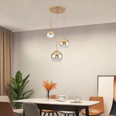 a dining room table with four chairs and a vase on the table next to it