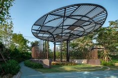 a large metal structure sitting in the middle of a park