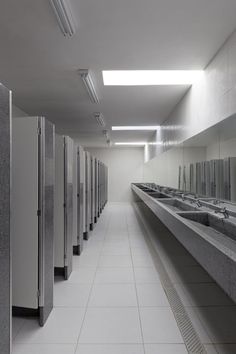 a long row of sinks in a public restroom