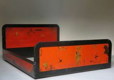 two orange and black trays sitting on top of each other