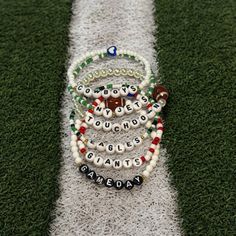 Football Team Beaded Bracelet  ✨ Please be sure to choose your style of choice and your bracelet size before checking out ✨ ☆ 𝙲𝙰𝚁𝙴 ☆ To maintain the quality of your SimplyjustKnotted piece,  -avoid direct contact with perfumes, lotions, and other chemicals  -remove when bathing, showering, swimming and sleeping  ☆𝚀𝚄𝙴𝚂𝚃𝙸𝙾𝙽𝚂☆ If you have any questions, please feel free to send me a message. I want you to love your pieces as much as I love making them❤️ Have fun picking out your favorite piece! ☆𝚂𝙸𝚉𝙴𝚂☆ Standard (non-specified) size will be 6.5 inches  6"kids/tween 6.5" standard woman 7" 7.5" me 8" standard men ☆Children Sizes☆ 4-5 Yrs- 5.75 inches 6-7 Yrs- 6 inches 8-9 Yrs- 6.25 inches 10-11 Yrs-6.5 inches 12-14 Yrs 6.75 inches Team-colored Bracelets With Letter Beads For Sports, Adjustable Bracelets For Game Day, Football Season, Football Bracelet, Choose Your Style, Man Child, I Want You, Love Your, Bracelet Sizes, Football Team