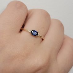 "Oval Cut Blue Sapphire And Diamond Engagement Ring, 14K Vintage Solitaire Sapphire Ring, Three Stone Engagement Ring, Anniversary Gift,   Ring Features:  * Made to Order. * Made in NYC. * Gold: Solid 14K ( Also available in18K ) * Width of band: 1.3mm * Choice of Gold: Yellow Gold, White Gold, Rose Gold, or Platinum * Gem Stone: Sapphire Stone, Mined Diamond  * Center stone: * Oval Sapphire 5.5mmX3mm   * Weight 0.21 Ct  * Side Stones details: * 2PCS Round Genuine Diamonds 1.4mm each Diamond 14k Gold Sapphire Ring With Accent Stones For Promise, Sapphire Oval Promise Jewelry, Blue Diamond Promise Ring In 14k Gold, Oval Sapphire Promise Ring In Fine Jewelry Style, Oval Sapphire Promise Ring Fine Jewelry, Elegant Sapphire Birthstone Ring In 14k Gold, 14k Gold Sapphire Diamond Ring With Gemstone, 14k Gold Sapphire Birthstone Promise Ring, Yellow Gold Sapphire Ring With Center Stone As Gift