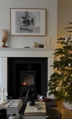 a living room with a christmas tree in the corner