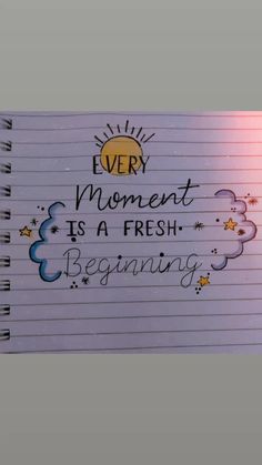 a notepad with writing on it that says every moment is a fresh beginning,