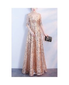 Buy sparkly champagne gold aline long formal dress vneck with sleeves at cheap price online. Free stable shipping and pro custom service since 2009. Formal Robes, Elegant Homecoming Dresses, Gold Prom, Gold Prom Dresses, Tulle Homecoming Dress, Dress Sleeve Styles, Formal Party Dress, Half Sleeve Dresses, Party Dress Short