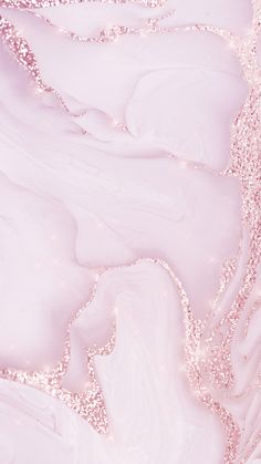 an abstract pink and white background with lots of glitter on the edges, like bubbles