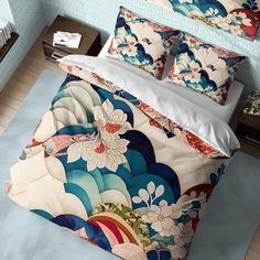 an image of a bed with colorful comforter and pillows on top of the bedspread