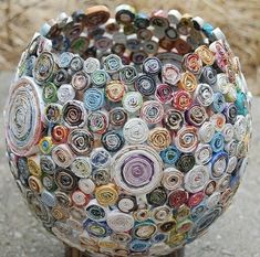 a vase made out of rolled up magazines