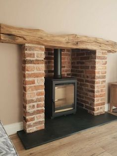 a wood burning stove sitting inside of a living room