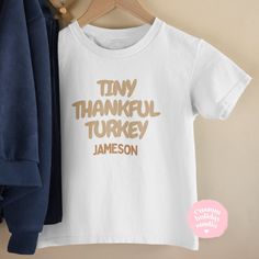 ✨Tiny thankful turkey kids t-shirt, cute baby Onesie®, Fall season toddler and kids shirt, Thanksgiving favor shirt, kids thanksgiving shirt, thanksgiving bodysuit kids, Thanksgiving Onesie®✨ Personalized Toddler shirts and baby Onesies® - Perfect fall and thanksgiving! Dress your little ones in something special this thanksgiving with our custom shirts and Onesies®! Made with high-quality fabrics and plenty of love, these items are perfect for creating unique, personalized outfits that your chi Thanksgiving Onesie, Thankful Turkey, Thanksgiving Favors, Kids Thanksgiving, Thanksgiving Dress, Thanksgiving Kids, Thanksgiving Shirt, Thanksgiving Shirts, Soft And Gentle