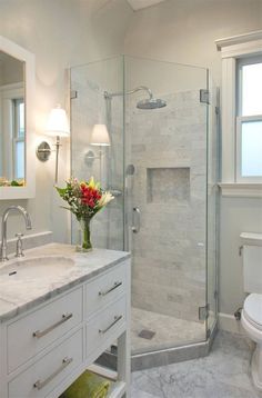 a bathroom with a sink, toilet and shower