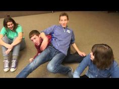 a group of young people sitting on the floor