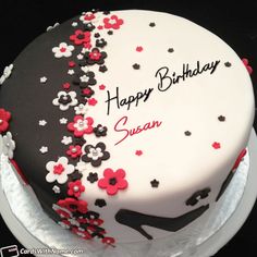 a white and black birthday cake with red flowers on the top, happy birthday disi