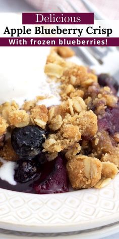 blueberry crisp with frozen blueberries on a white plate