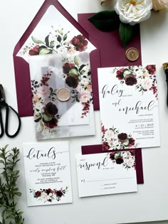 wedding stationery with burgundy and white flowers