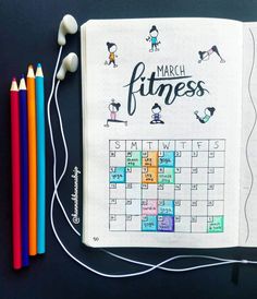 the march fitness calendar is surrounded by colored pencils