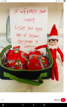 an elf with a sign in his suitcase