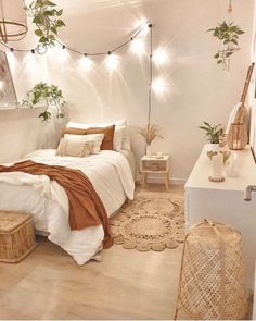 a bed room with a neatly made bed and lots of plants on the wall above it