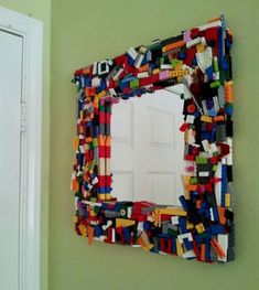 a baby and children zone's post on the wall with a mirror made out of legos